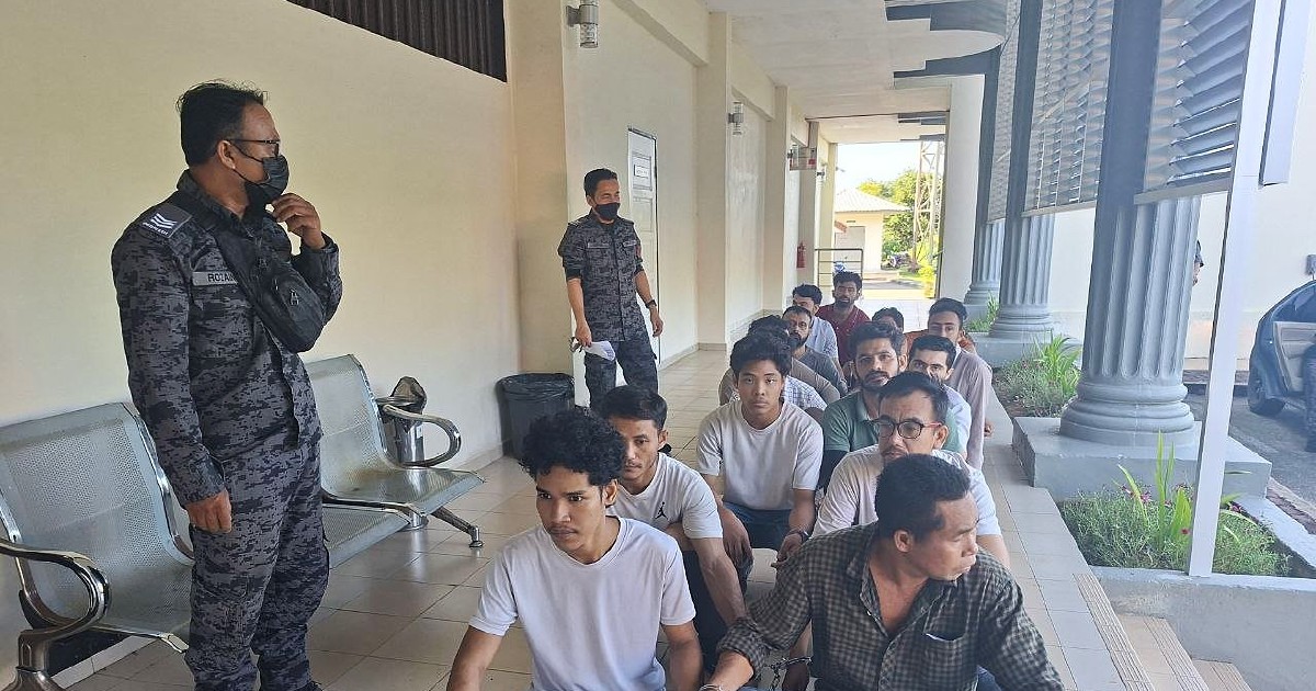 Fourteen Foreigners Face Court Over Illegal Entry and Overstaying Charges in Pasir Mas