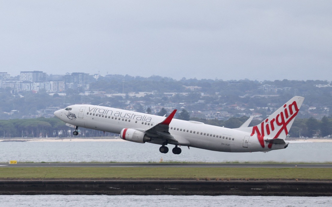 Jetstar and Qatar Airways Planes Near-Collide on Sydney Runway, Crew Member Injured