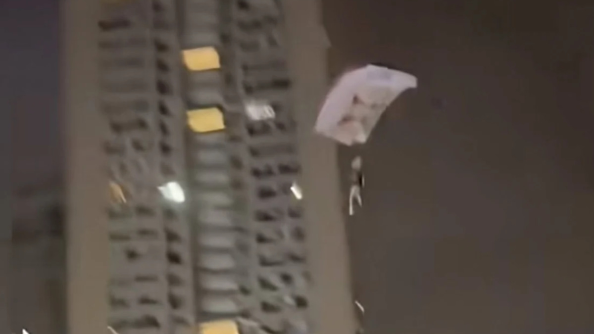 Chinese man detained after illegal rooftop skydive stunt goes viral