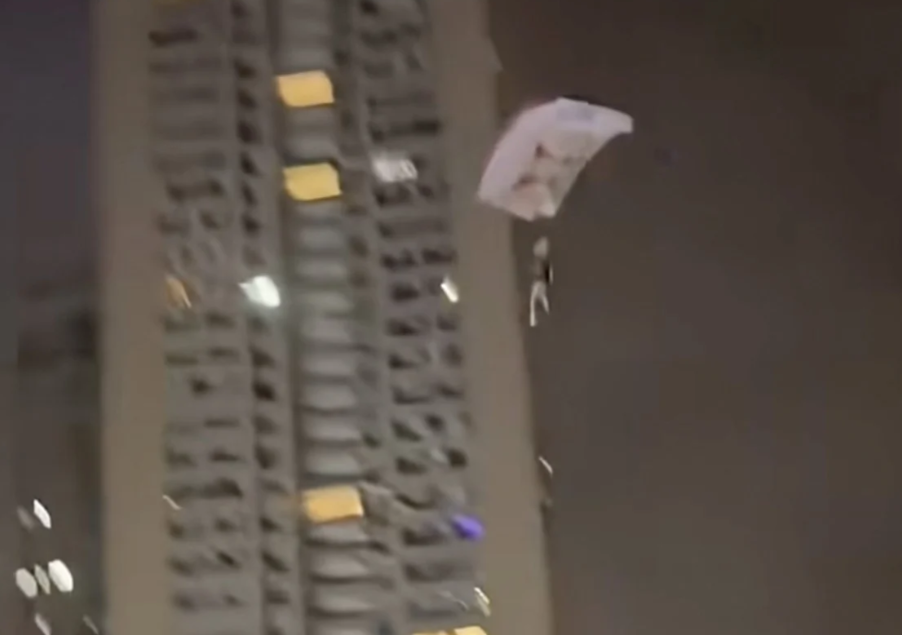 Chinese man detained after illegal rooftop skydive stunt goes viral