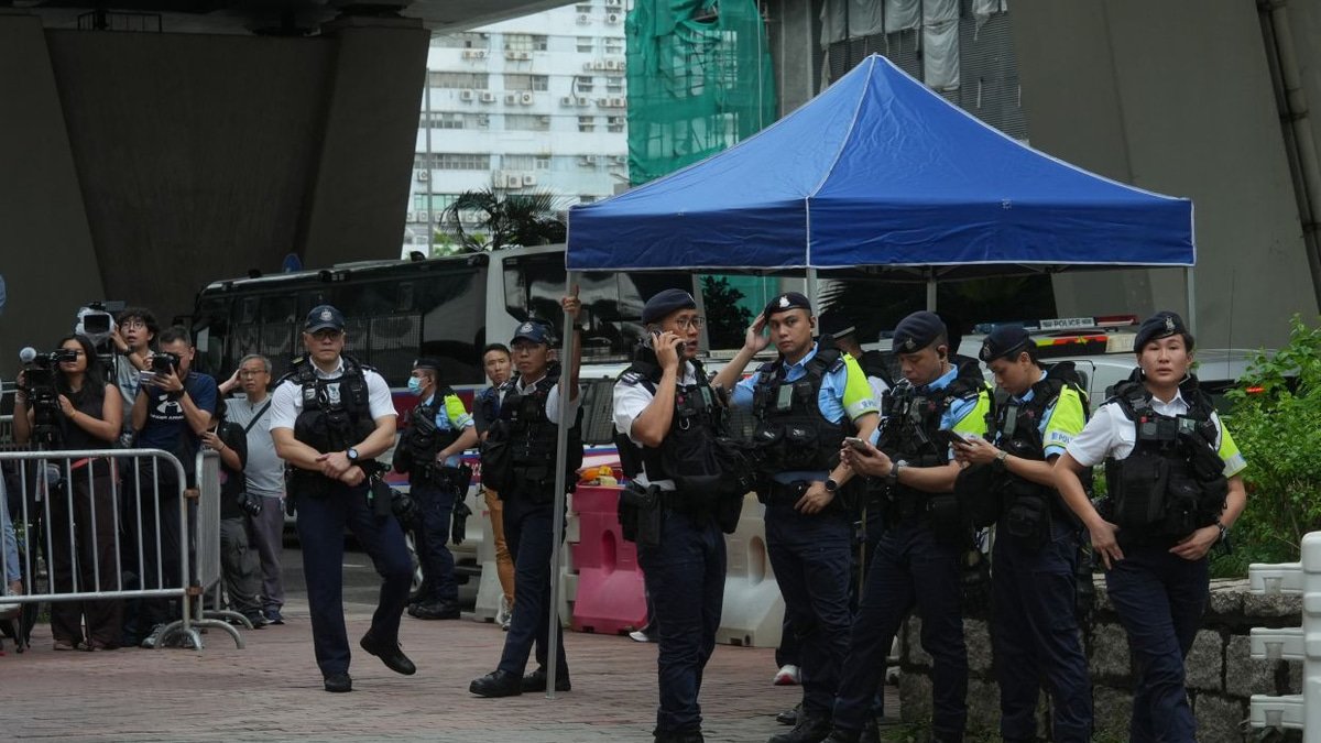Hong Kong Woman Arrested for Seditious T-Shirt Outside Court as Landmark Subversion Trial Concludes