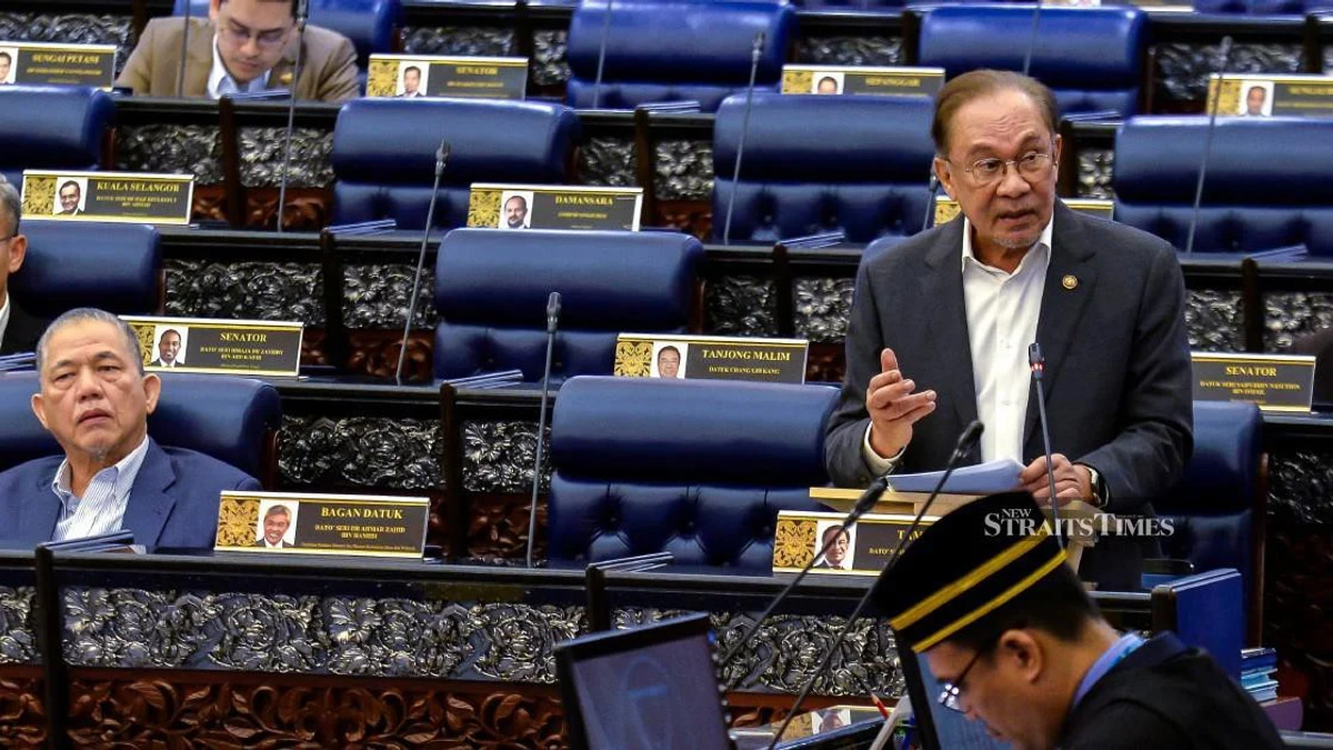 E-wallet providers must compensate scam victims if security fails, Anwar says