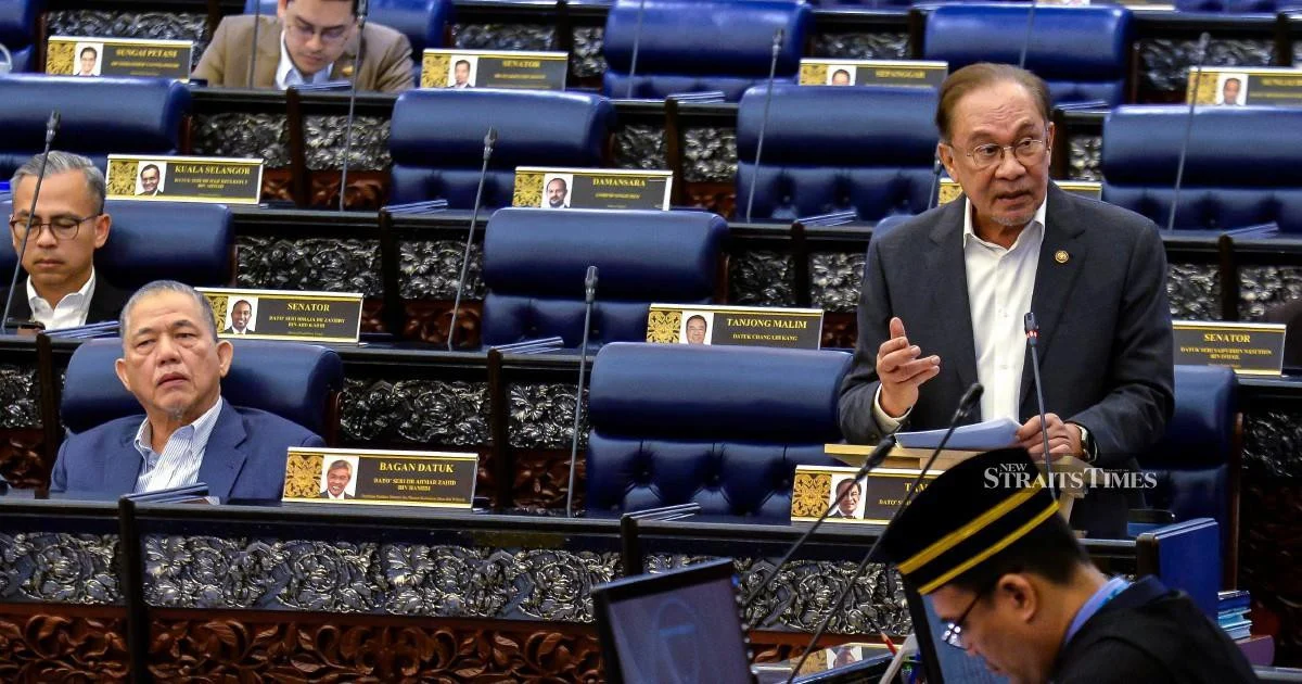 E-wallet providers must compensate scam victims if security fails, Anwar says