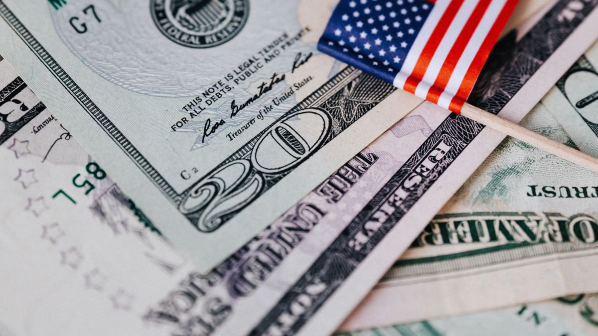 Dollar slumps on weak jobs data as Fed rate hike bets cool
