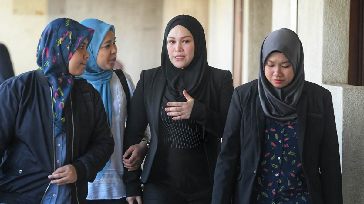 Zizie Izette appears in court as judges prepare corruption verdict
