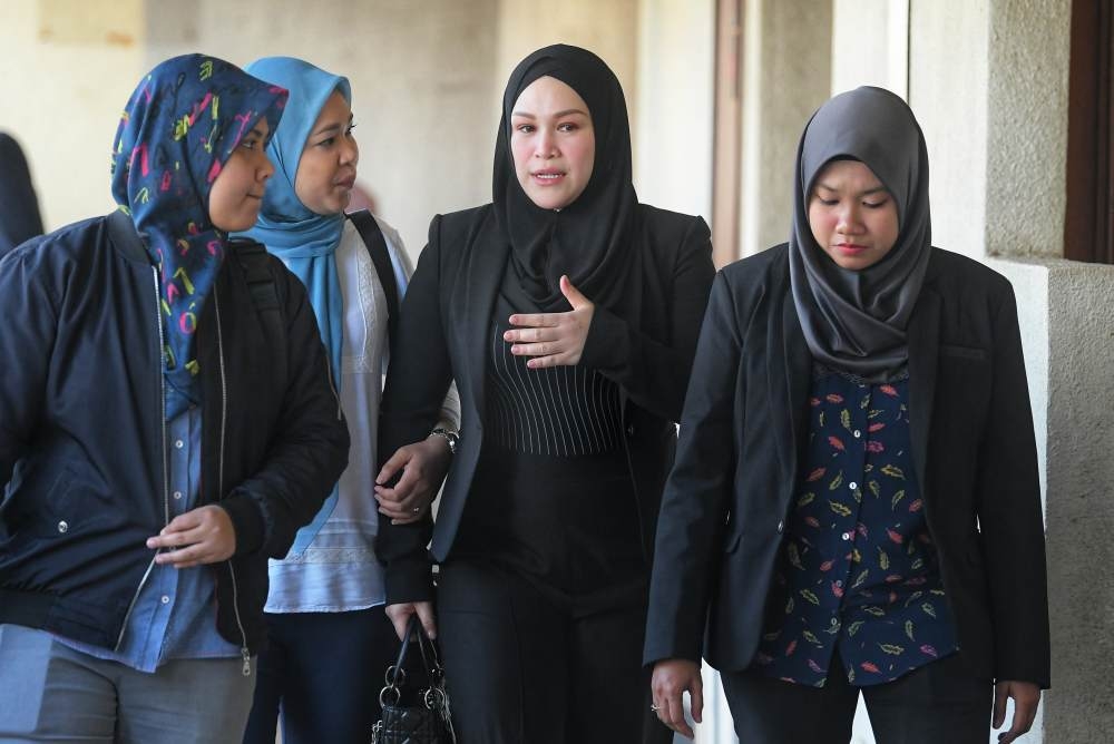 Zizie Izette appears in court as judges prepare corruption verdict